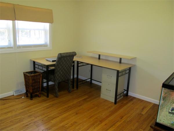 439 Warren Wright Road Belchertown, MA 01007 - Photo 8 of 13 a view of a workspace with furniture and a window