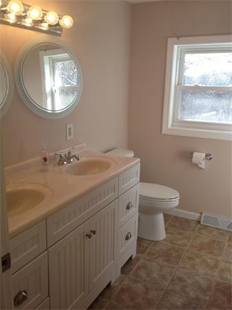 439 Warren Wright Road Belchertown, MA 01007 - Photo 9 of 13 a bathroom with a toilet a sink and mirror