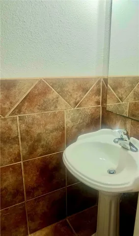 a bathroom with a sink and a shower