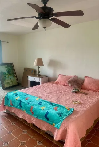 a bedroom with a bed and a couch