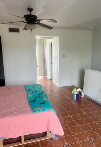 a bedroom with a bed and a walk in closet