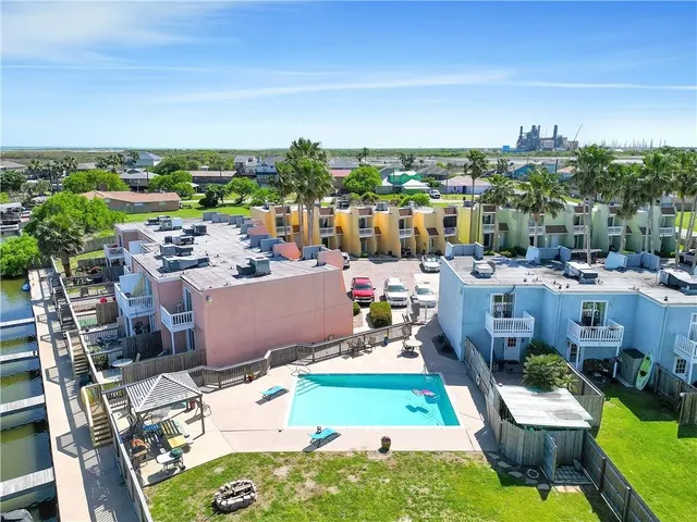 a view of a chairs and table in backyard