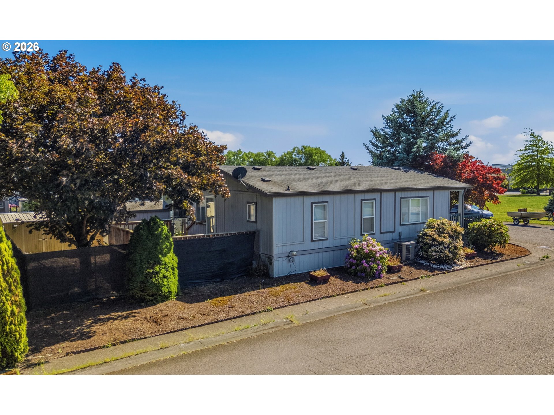 2151 Three Lakes Road Southeast Albany, OR 97322 - Photo 3 of 25 a front view of a house with a yard and a garage