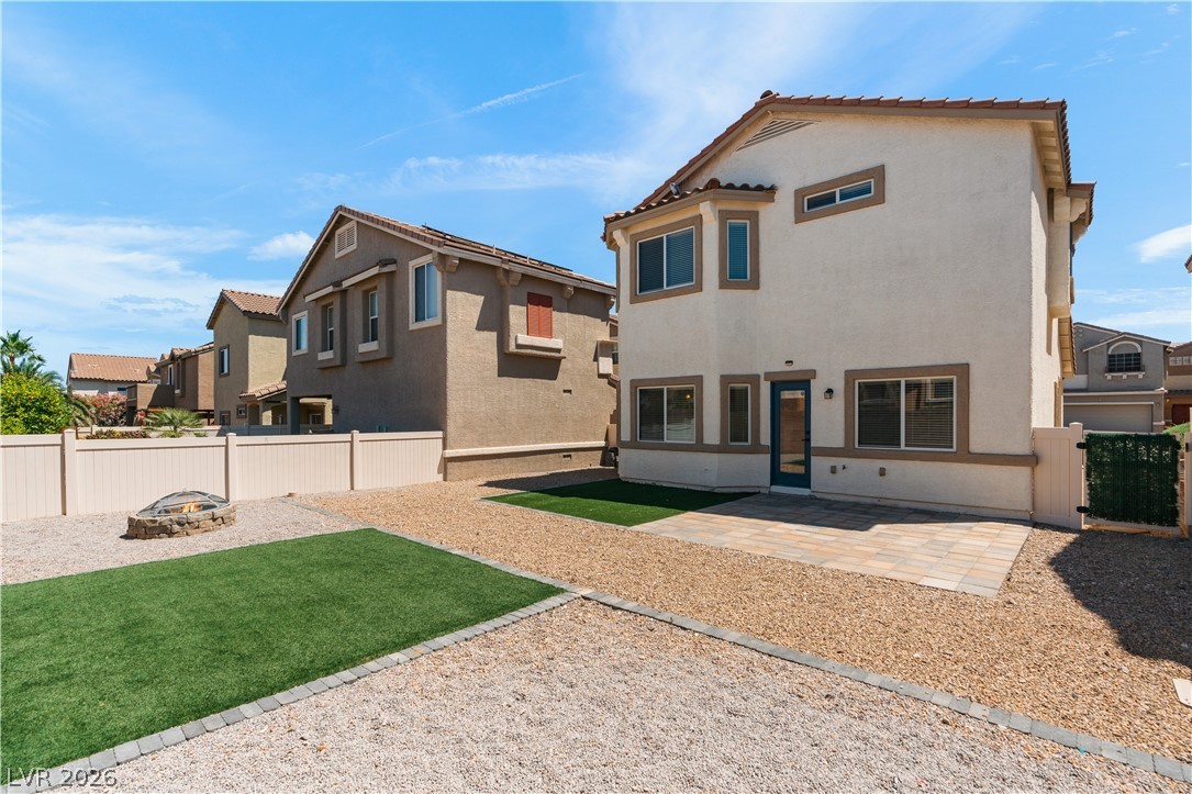 1328 Spice Ridge Court Henderson, NV 89012 - Photo 37 of 51 This outdoor space offers a private retreat with a combination of gravel, artificial turf, and a paved patio.