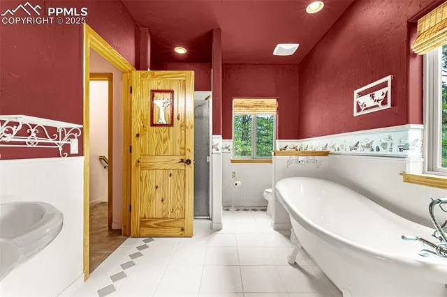 a bathroom with a sink a mirror and a bathtub