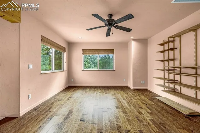 a view of a room with wooden floor and staircase