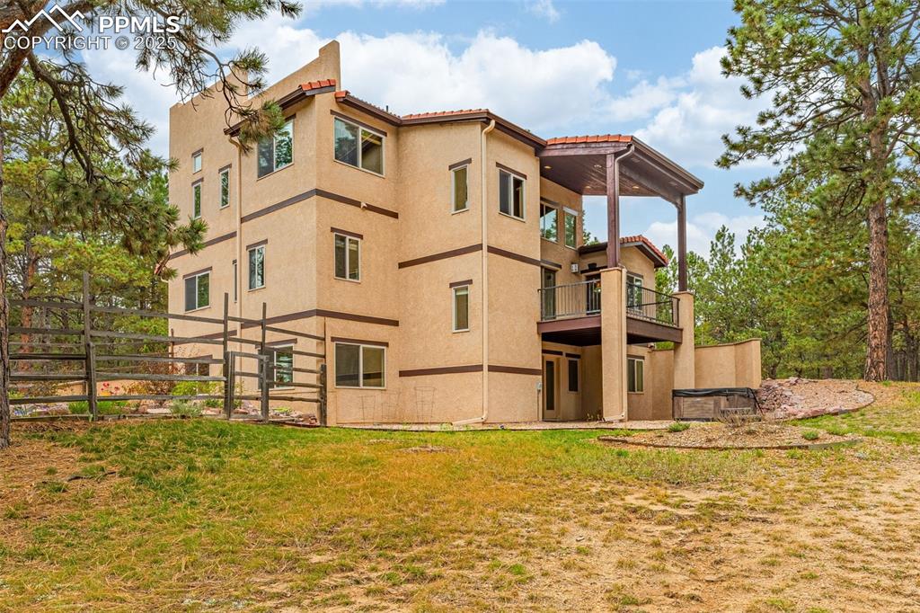9890 Hardy Road Colorado Springs, CO 80908 - Photo 2 of 41 a view of a house with wooden fence