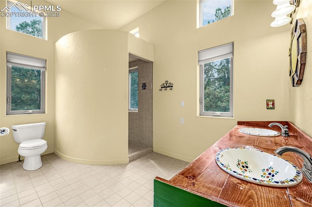 9890 Hardy Road Colorado Springs, CO 80908 - Photo 24 of 41 a view of a bathroom with a toilet and a sink