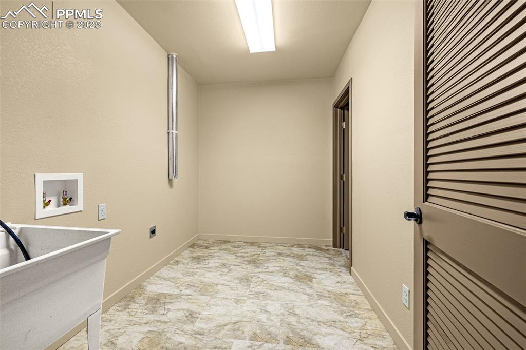 9890 Hardy Road Colorado Springs, CO 80908 - Photo 32 of 41 a view of a room with a sink and refrigerator