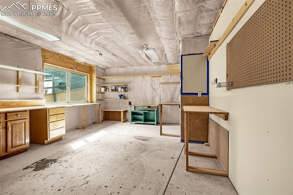 9890 Hardy Road Colorado Springs, CO 80908 - Photo 33 of 41 a view of a kitchen with furniture and a kitchen