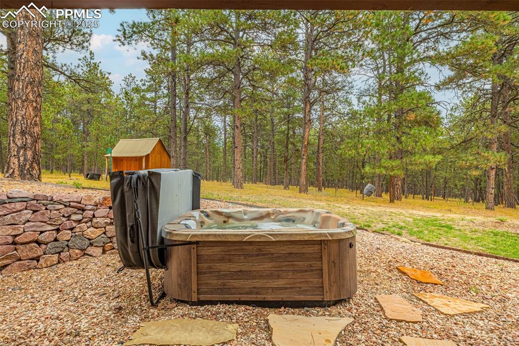 9890 Hardy Road Colorado Springs, CO 80908 - Photo 36 of 41 a view of a backyard with wooden fence