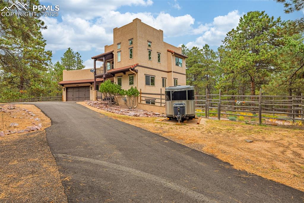 9890 Hardy Road Colorado Springs, CO 80908 - Photo 37 of 41 a view of a house with wooden fence