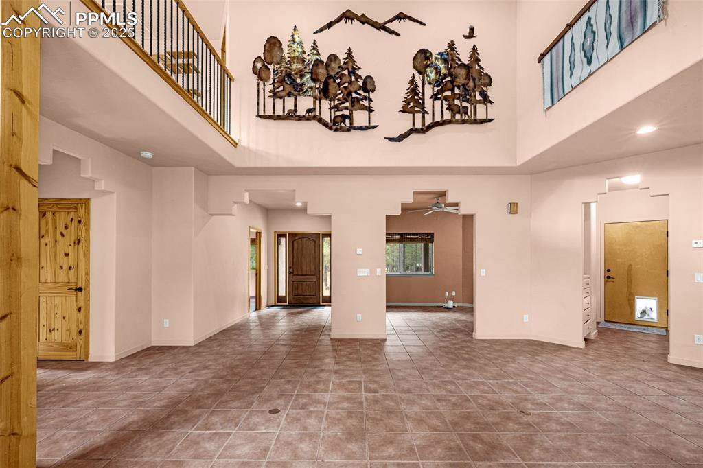9890 Hardy Road Colorado Springs, CO 80908 - Photo 7 of 41 a view of a hallway with wooden floor