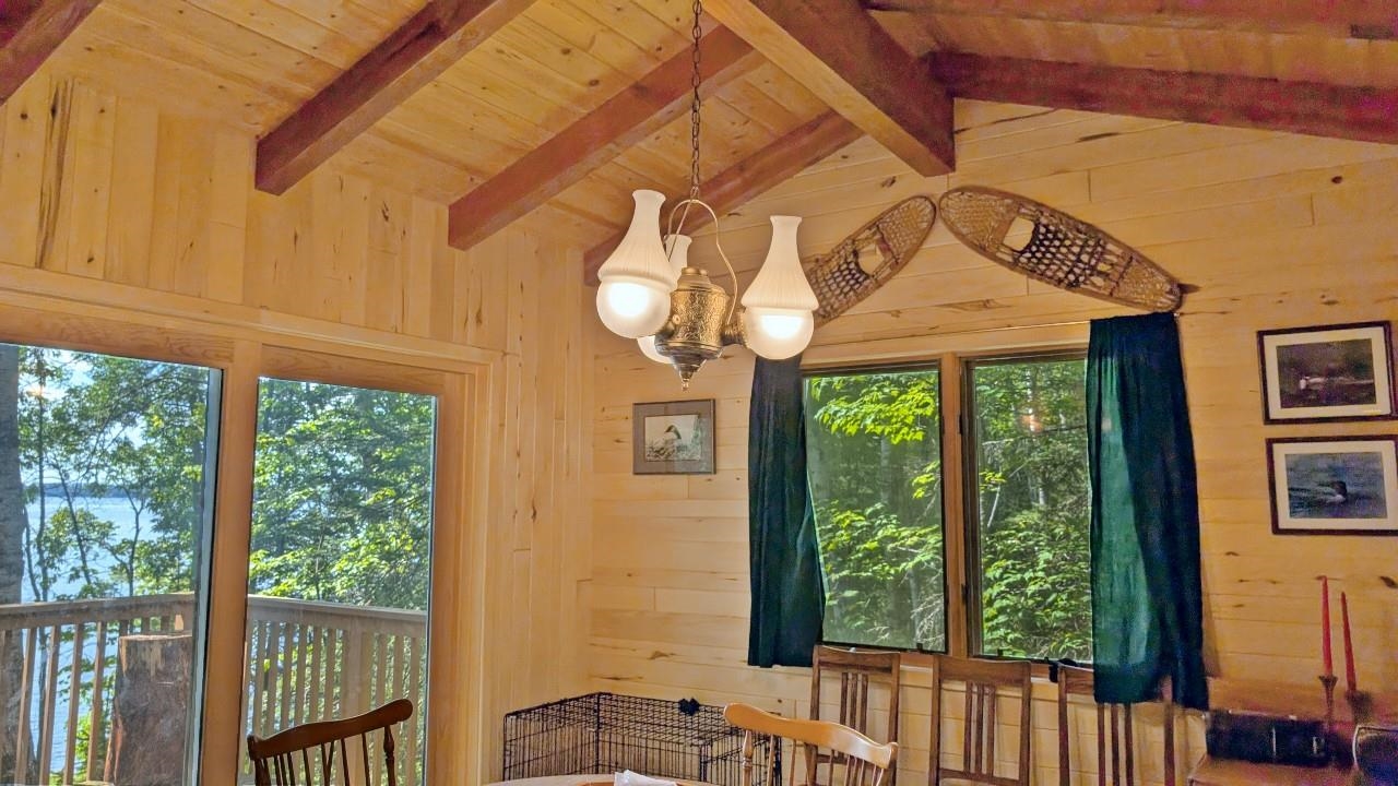 8884 Raps Road Cook, MN 55723 - Photo 17 of 46 Dining room with wooden walls and wood ceiling