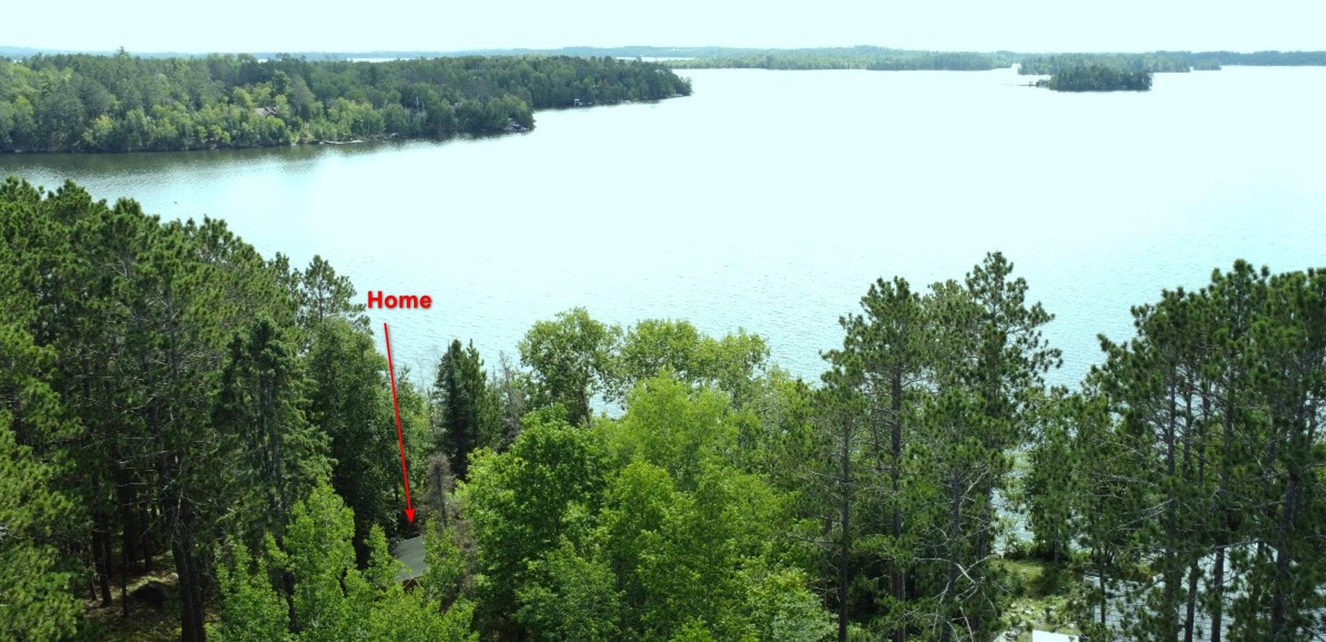 8884 Raps Road Cook, MN 55723 - Photo 37 of 46 Drone / aerial view of a heavily wooded area and a large body of water