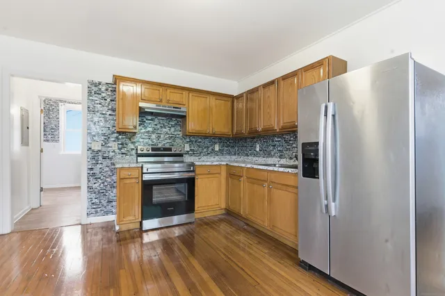 a bathroom with a sink toilet and mirror