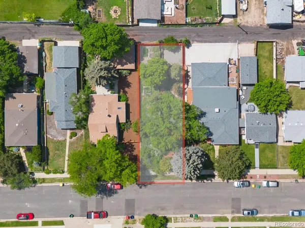 an aerial view of a houses with yard