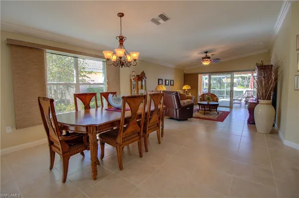 a view of a dining room with furniture window and outside view