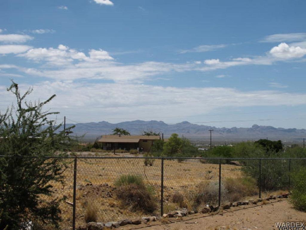 3550 North Bryce Road Golden Valley, AZ 86413 - Photo 7 of 18 a view of a lake with a mountain in the background