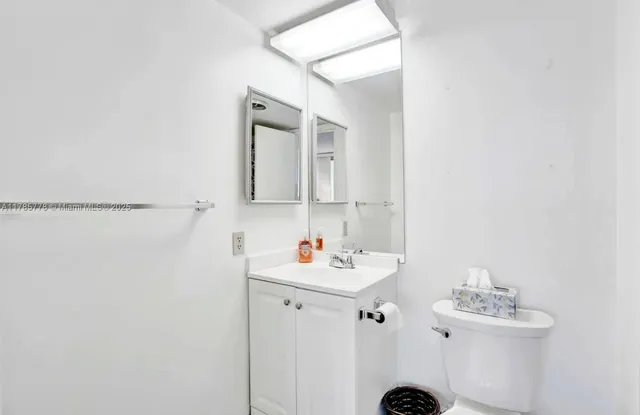 a view of a patio with dining table and chairs with a large tree