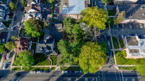 an aerial view of a residential houses with outdoor space