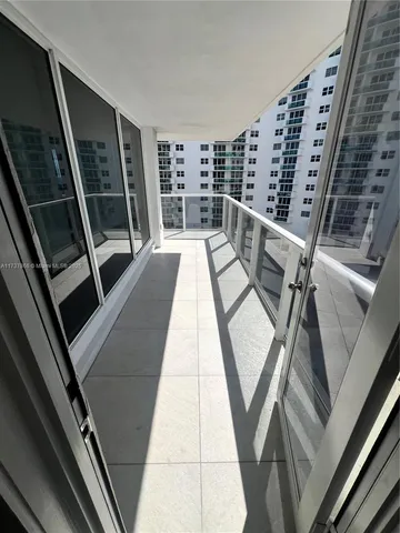 a bathroom with a sink a toilet a mirror and shower