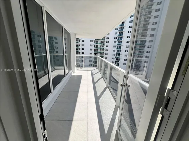 a spacious bedroom with a bed and a couch