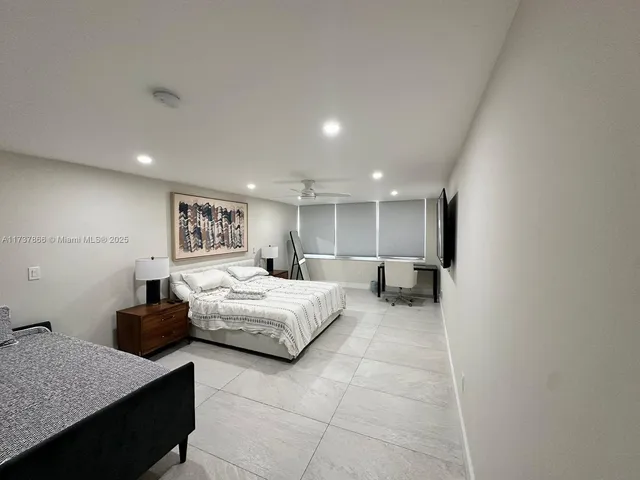 a bathroom with a sink a toilet and bathtub