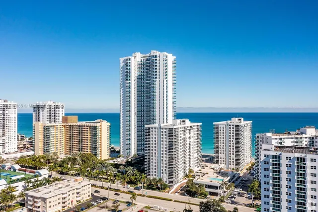 a view of a bathroom with a bathtub and sink