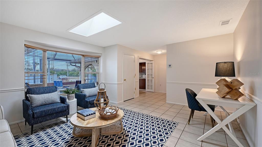619 Albee Farm Road North Nokomis, FL 34275 - Photo 11 of 93 a living room with furniture and a window