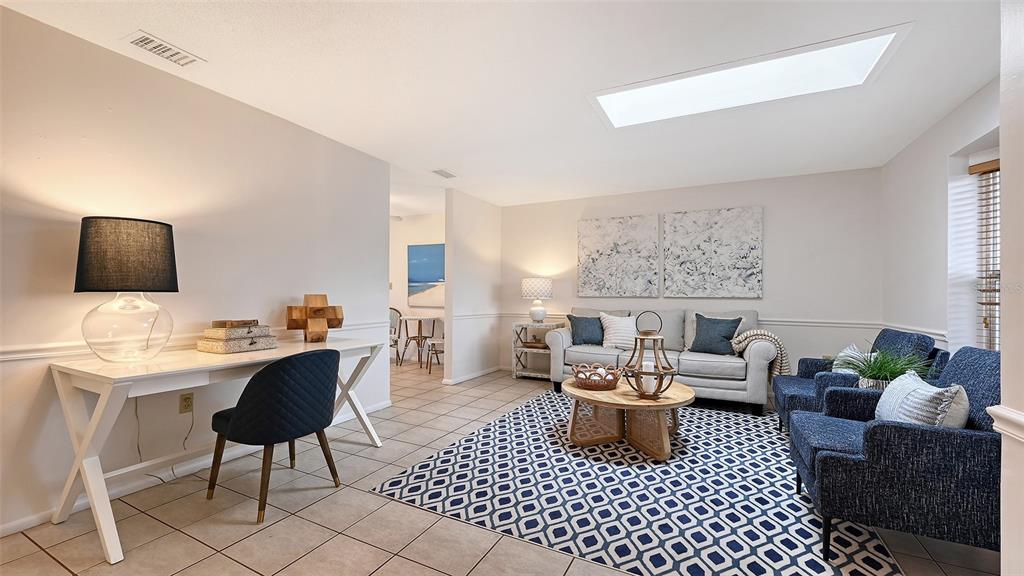 619 Albee Farm Road North Nokomis, FL 34275 - Photo 13 of 93 a living room with furniture and a lamp