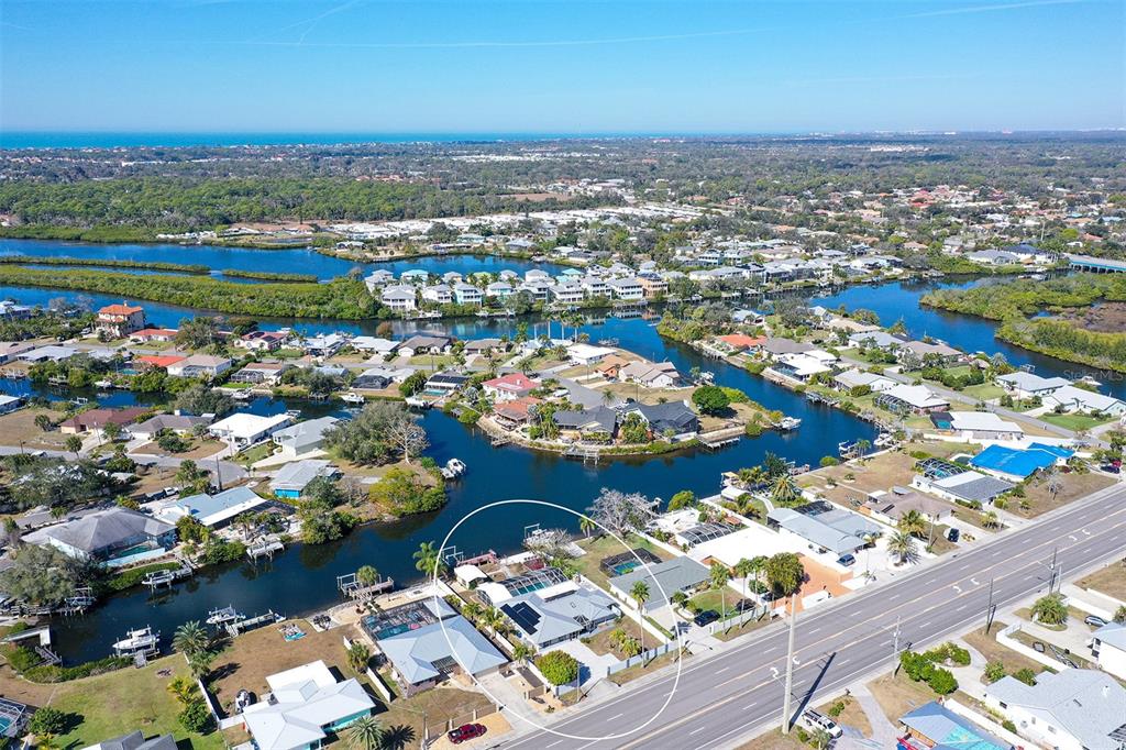 619 Albee Farm Road North Nokomis, FL 34275 - Photo 2 of 93 an aerial view of a city with lots of residential buildings and ocean view in back