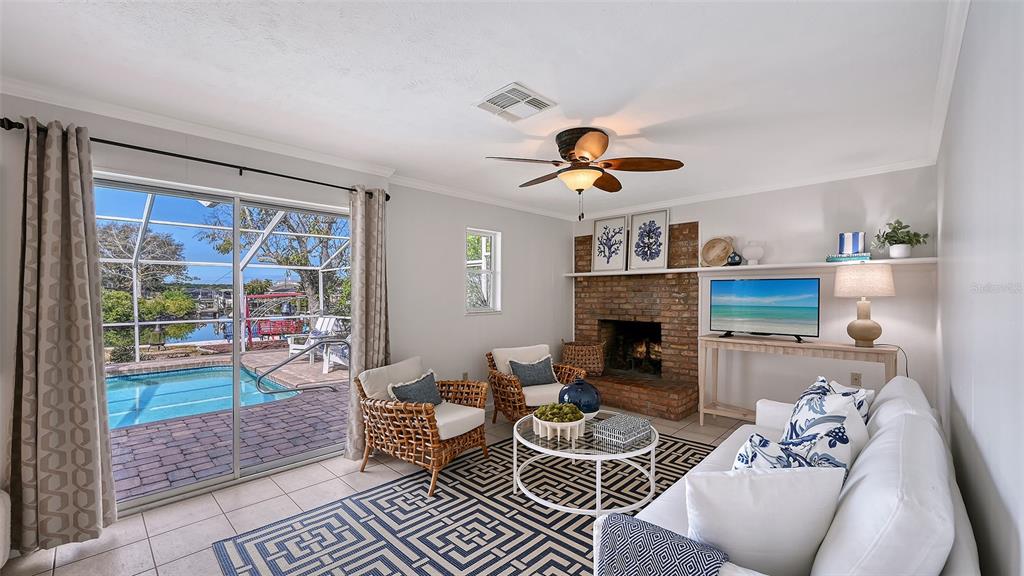 619 Albee Farm Road North Nokomis, FL 34275 - Photo 25 of 93 a living room with furniture and a fireplace