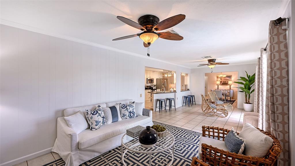 619 Albee Farm Road North Nokomis, FL 34275 - Photo 27 of 93 a living room with furniture and a chandelier