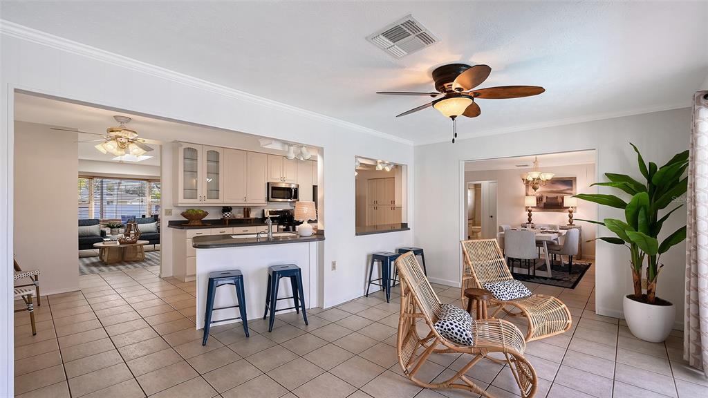 619 Albee Farm Road North Nokomis, FL 34275 - Photo 29 of 93 a living room with furniture a chandelier and a dining table