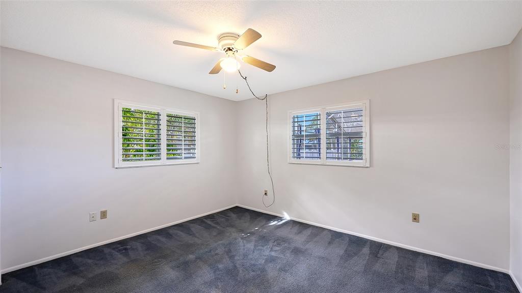 619 Albee Farm Road North Nokomis, FL 34275 - Photo 46 of 93 an empty room with windows and fan