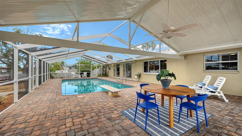 619 Albee Farm Road North Nokomis, FL 34275 - Photo 55 of 93 a view of a patio with table and chairs under an umbrella