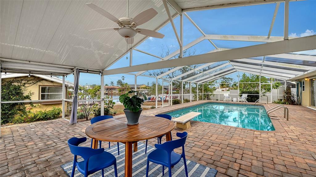 619 Albee Farm Road North Nokomis, FL 34275 - Photo 56 of 93 a view of a patio with a table and chairs