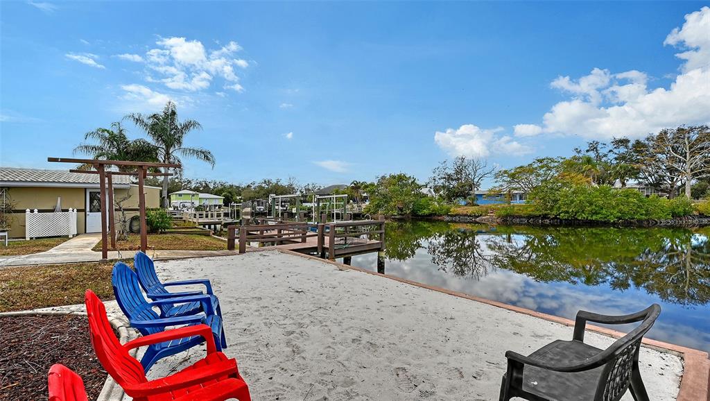 619 Albee Farm Road North Nokomis, FL 34275 - Photo 63 of 93 a swimming pool with outdoor seating and lake view