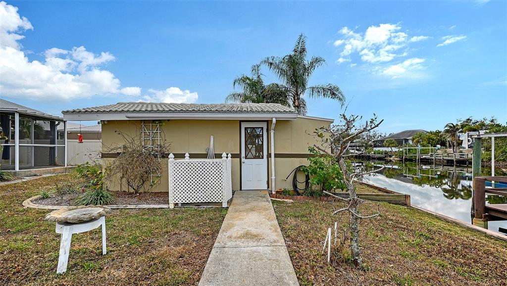 619 Albee Farm Road North Nokomis, FL 34275 - Photo 70 of 93 a front view of a house with a garden