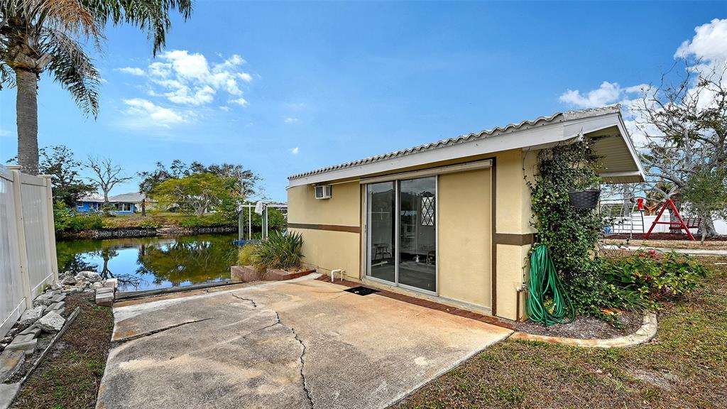 619 Albee Farm Road North Nokomis, FL 34275 - Photo 73 of 93 a front view of a house with a yard and garage