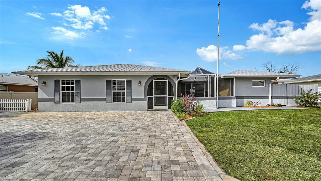 619 Albee Farm Road North Nokomis, FL 34275 - Photo 9 of 93 a front view of a house with garden