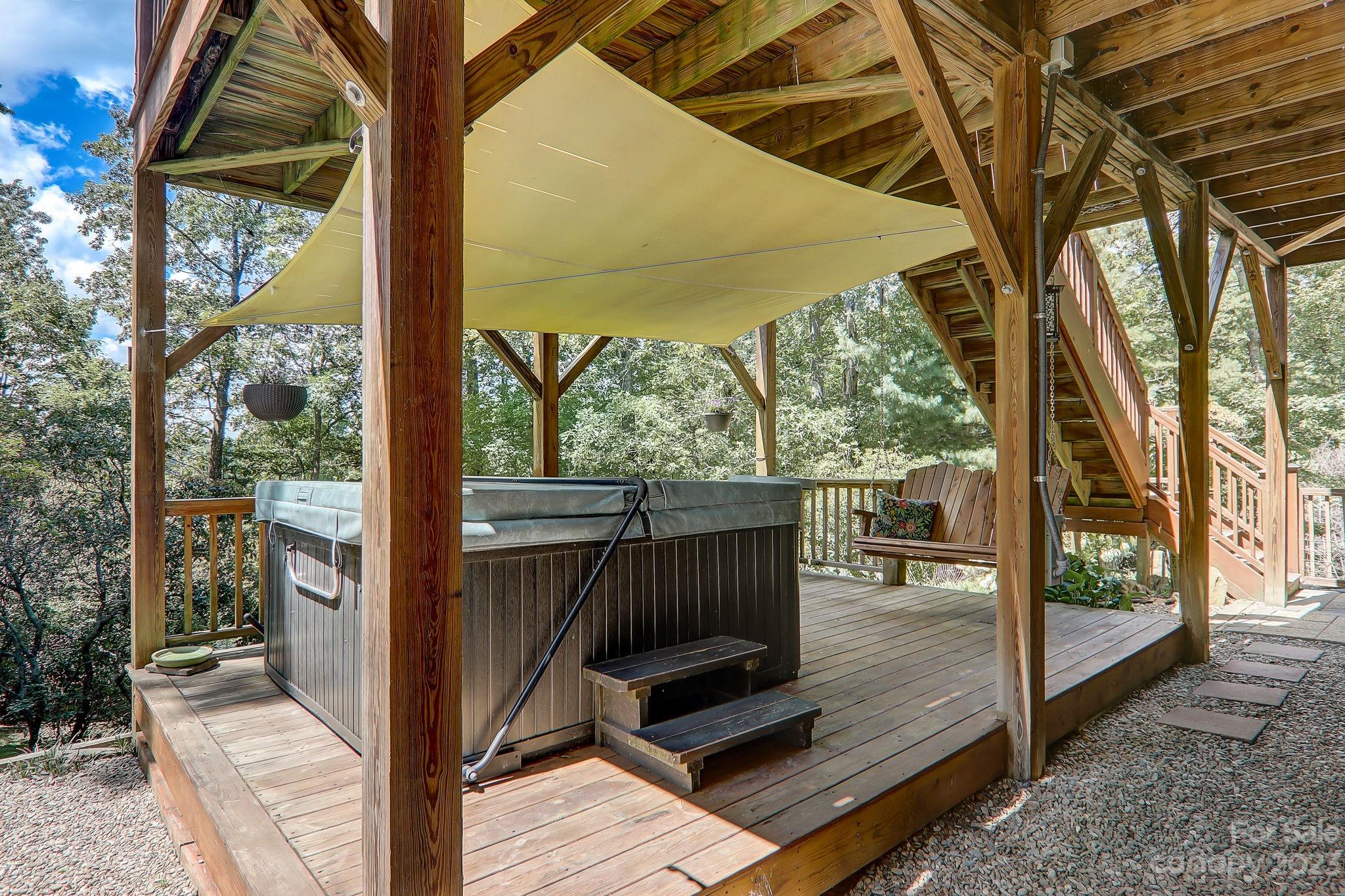 209 Whitaker Road Fairview, NC 28730 - Photo 31 of 44 a view of a two chairs in the deck