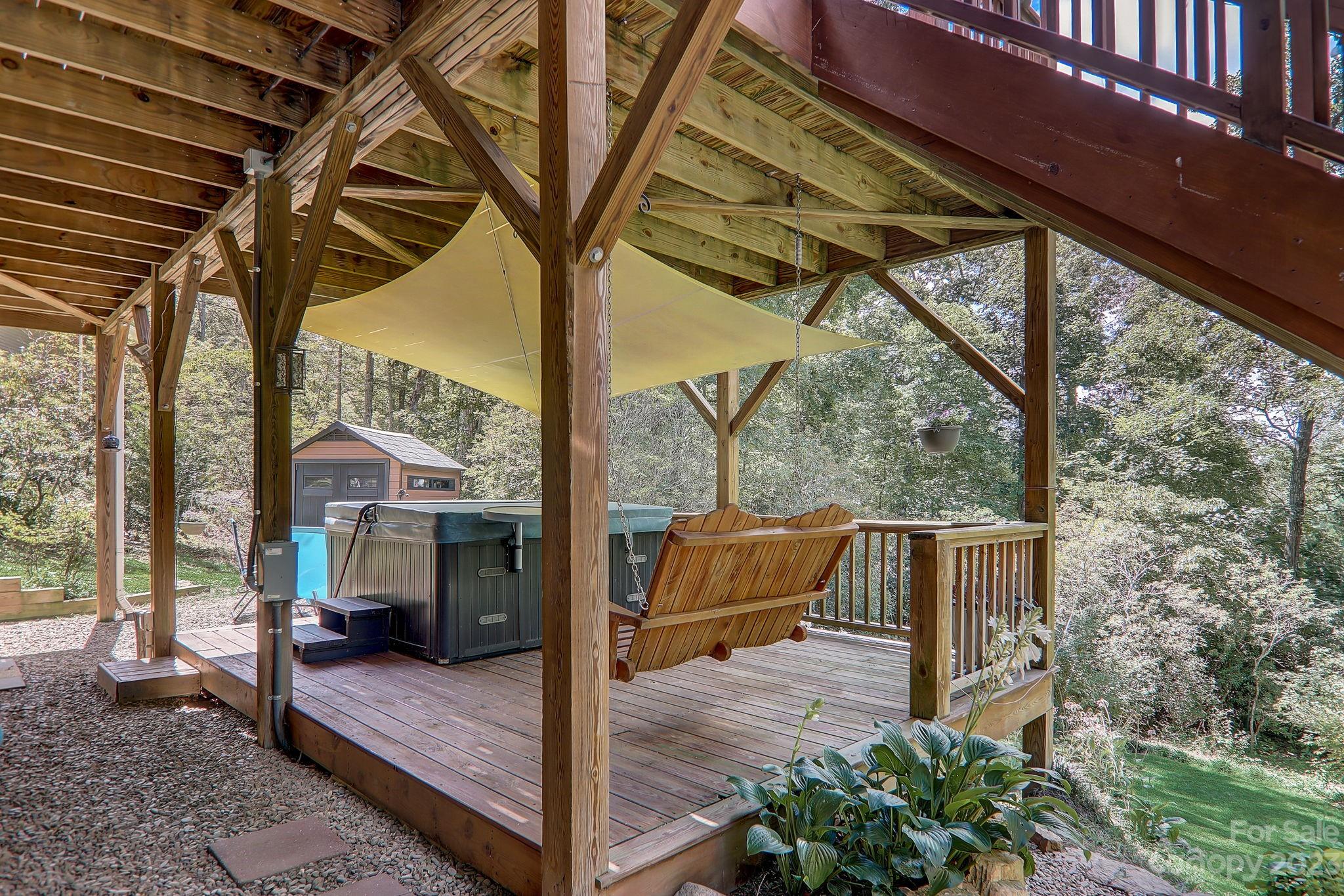 209 Whitaker Road Fairview, NC 28730 - Photo 32 of 44 a view of a porch with furniture and a yard