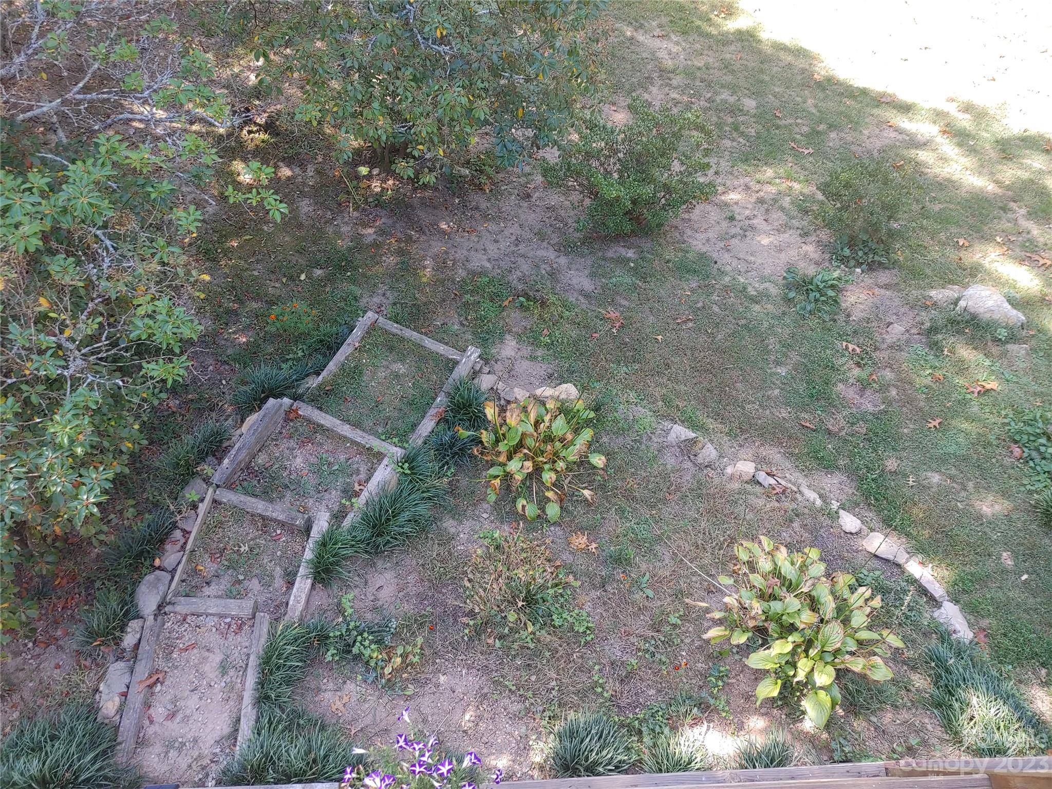 209 Whitaker Road Fairview, NC 28730 - Photo 42 of 44 a backyard of a house with outdoor seating