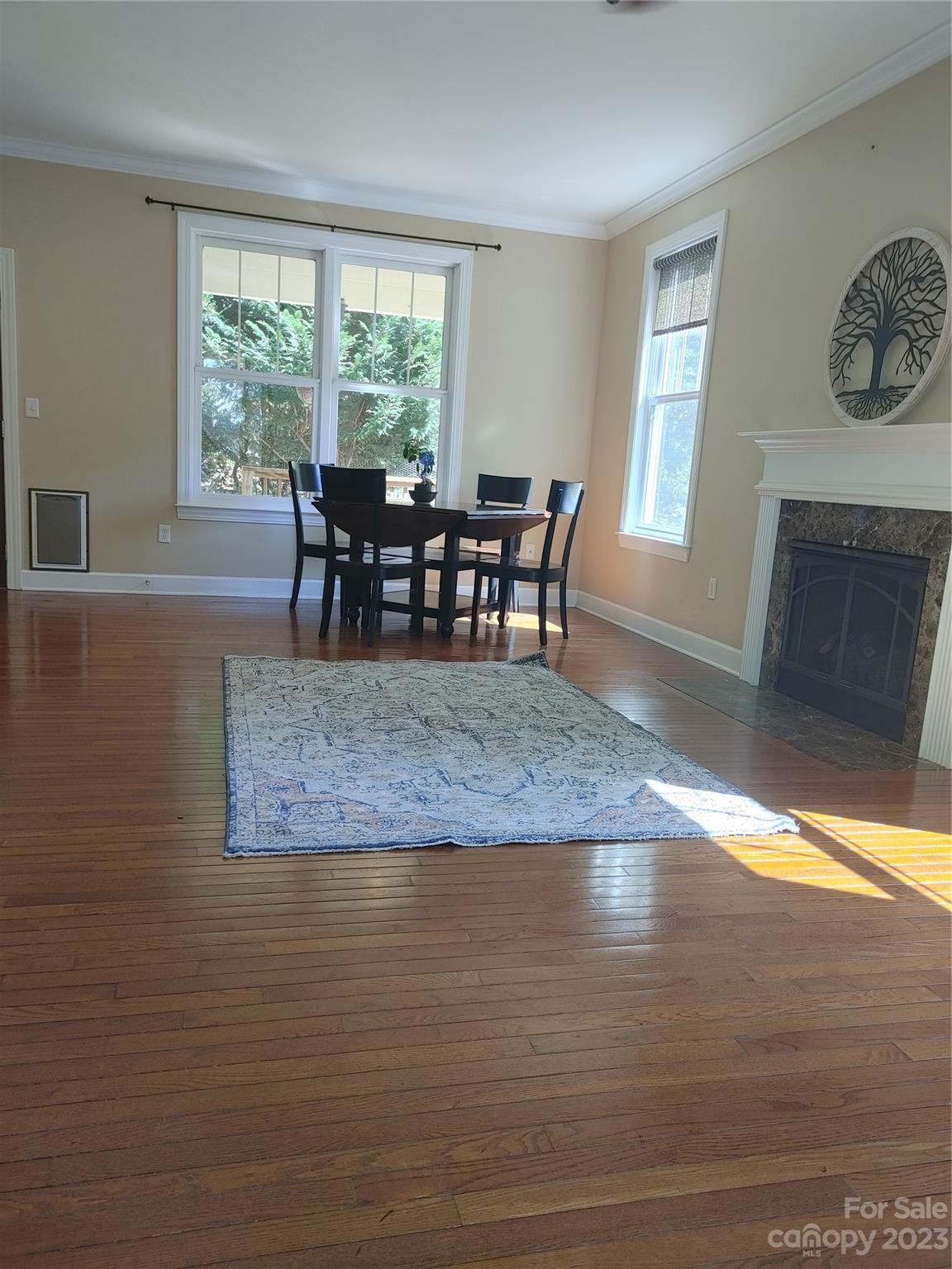 209 Whitaker Road Fairview, NC 28730 - Photo 43 of 44 a view of a dining room with furniture window and wooden floor