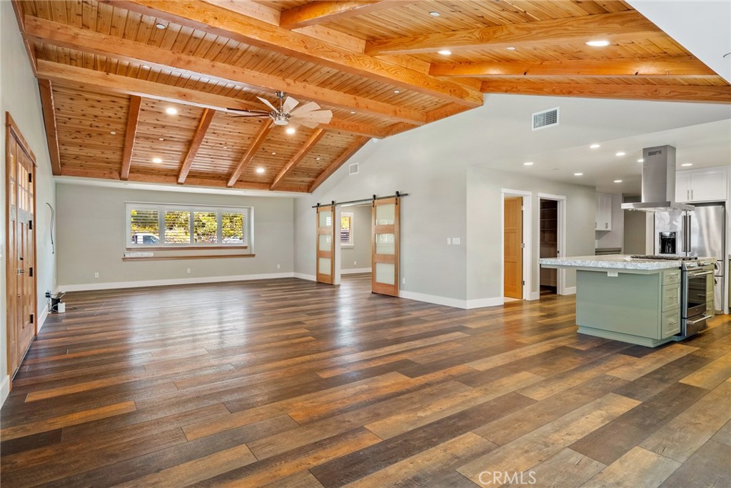a view of a room with window and wooden floor