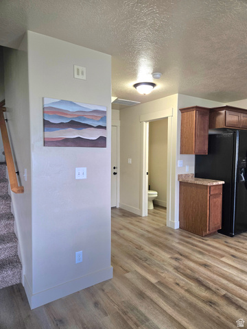 601 West 150 North, Unit 25 Springville, UT 84663 - Photo 11 of 29 Open concept living space featuring wood-finish flooring, a neutral color palette, and a recessed lighting fixture