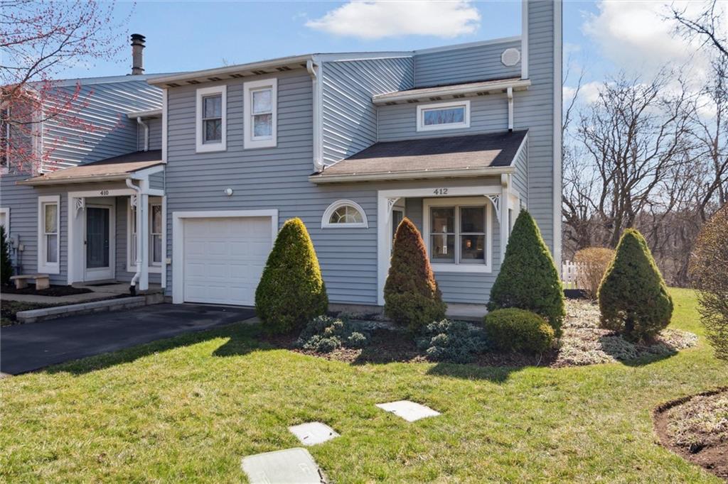 412 Chandler Place Pittsburgh, PA 15212 - Photo 2 of 38 a front view of a house with garden