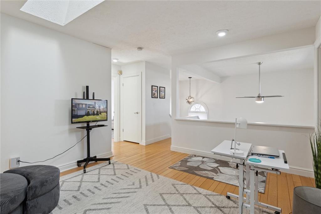 412 Chandler Place Pittsburgh, PA 15212 - Photo 23 of 38 a living room with furniture a rug and white walls